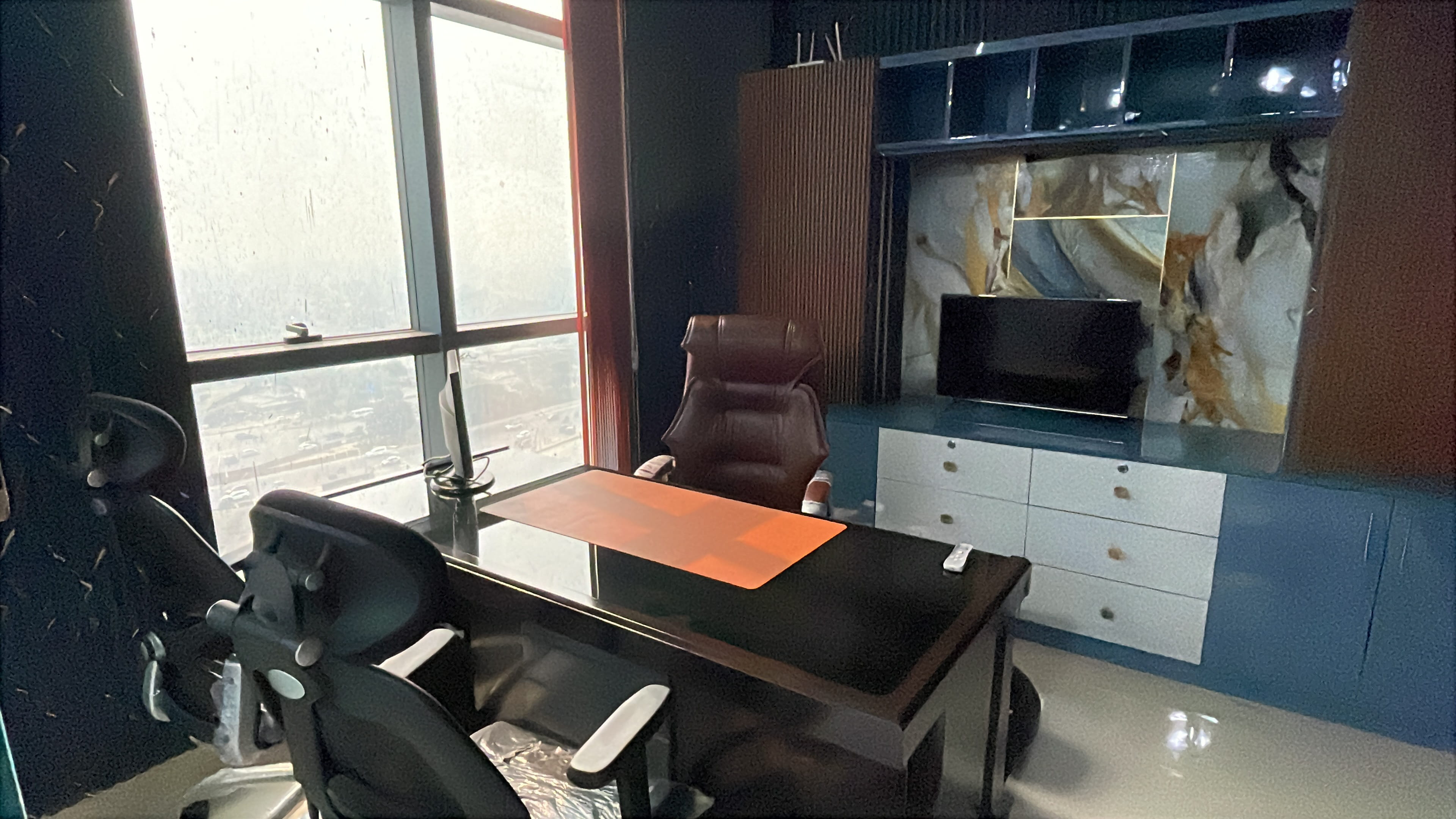 Modern private office with desks and glass walls
