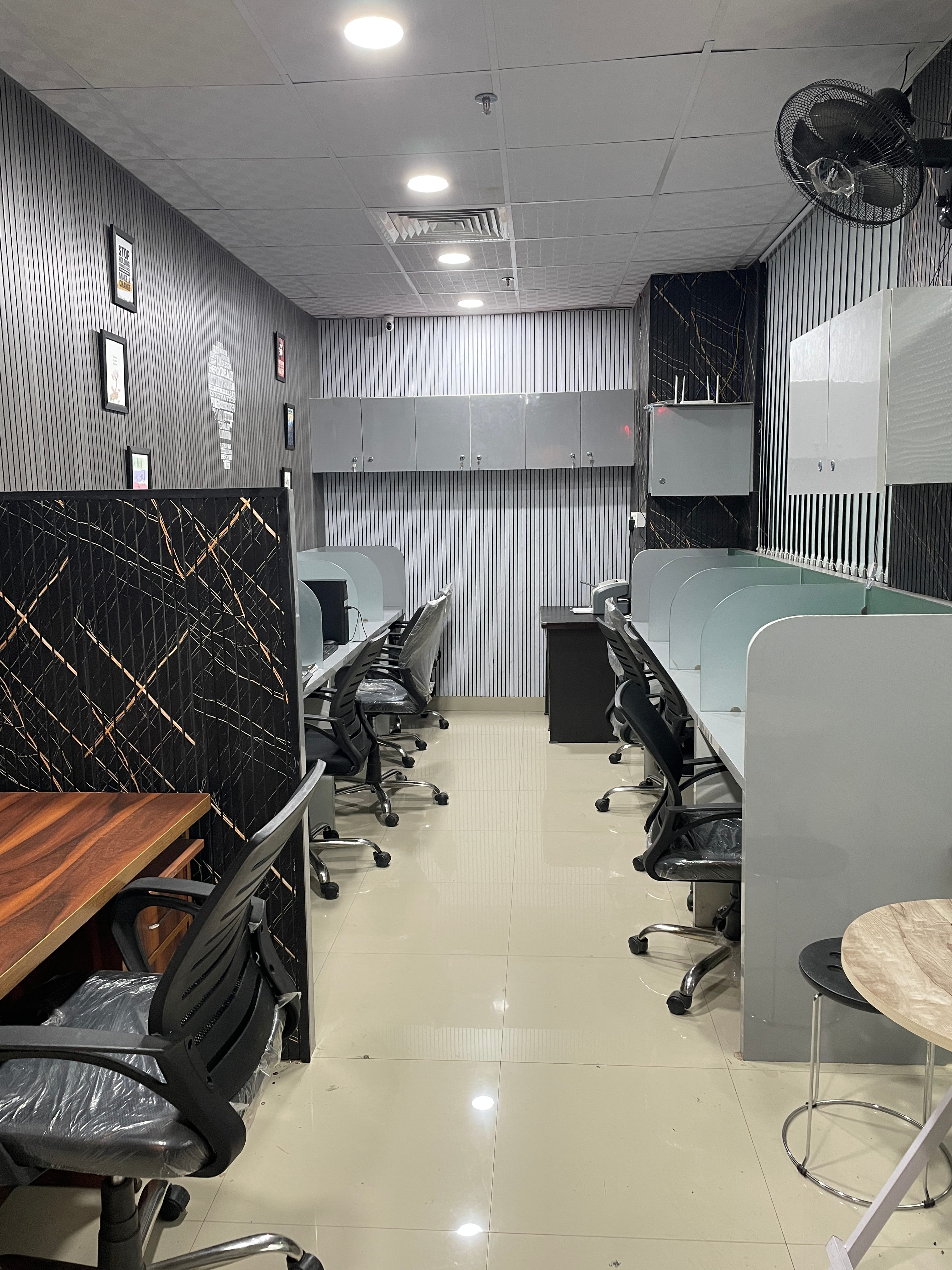 Open coworking lounge with desks and natural light